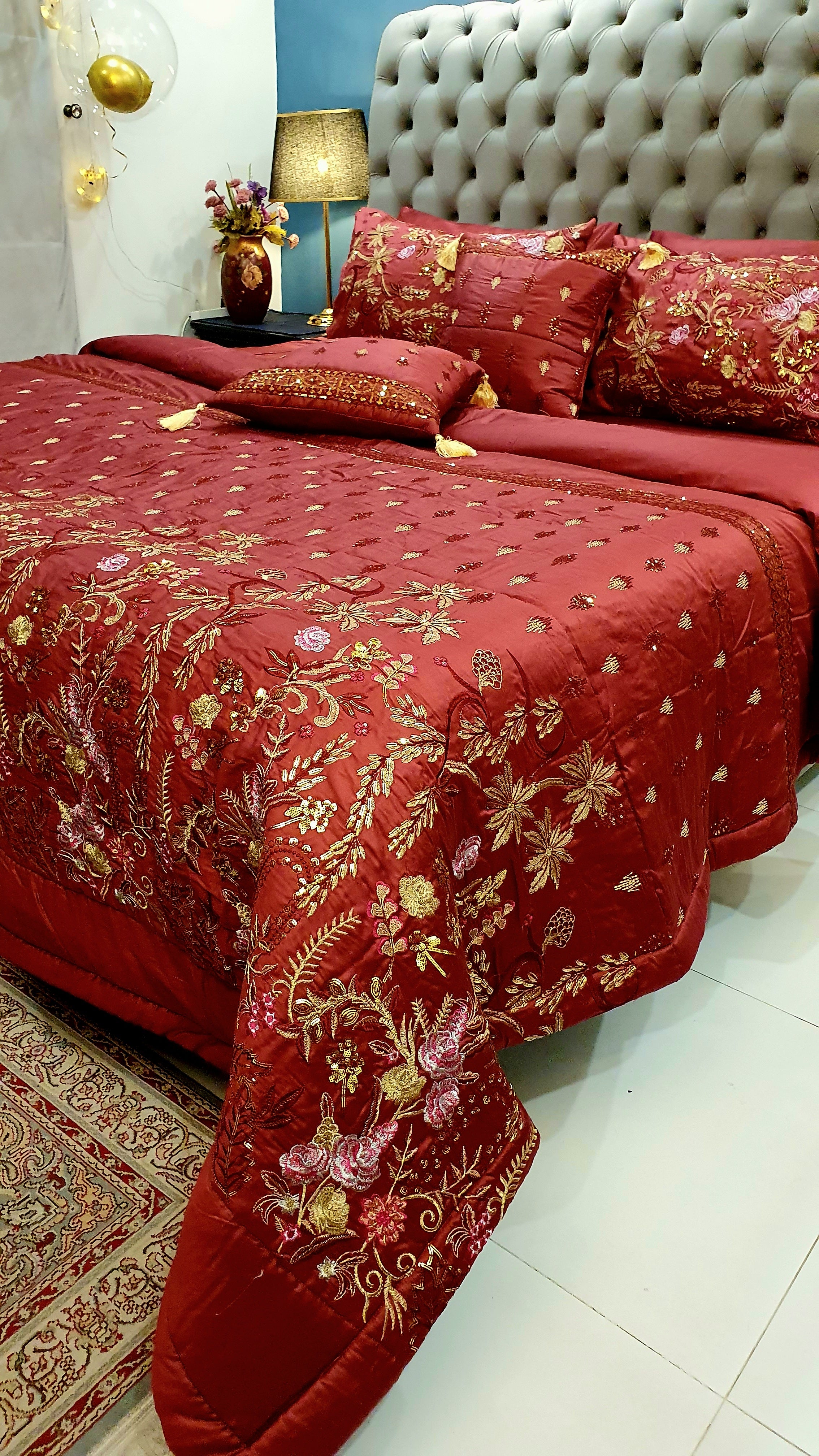Maroon embroidered bedding detail